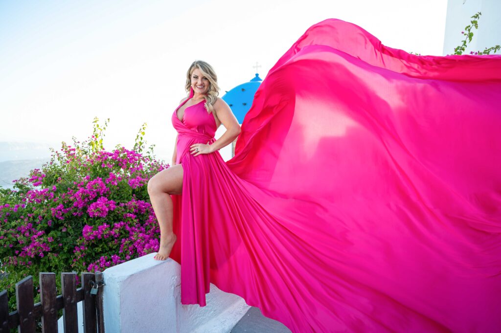 Stunning flowing pink dress with flowers and sea view