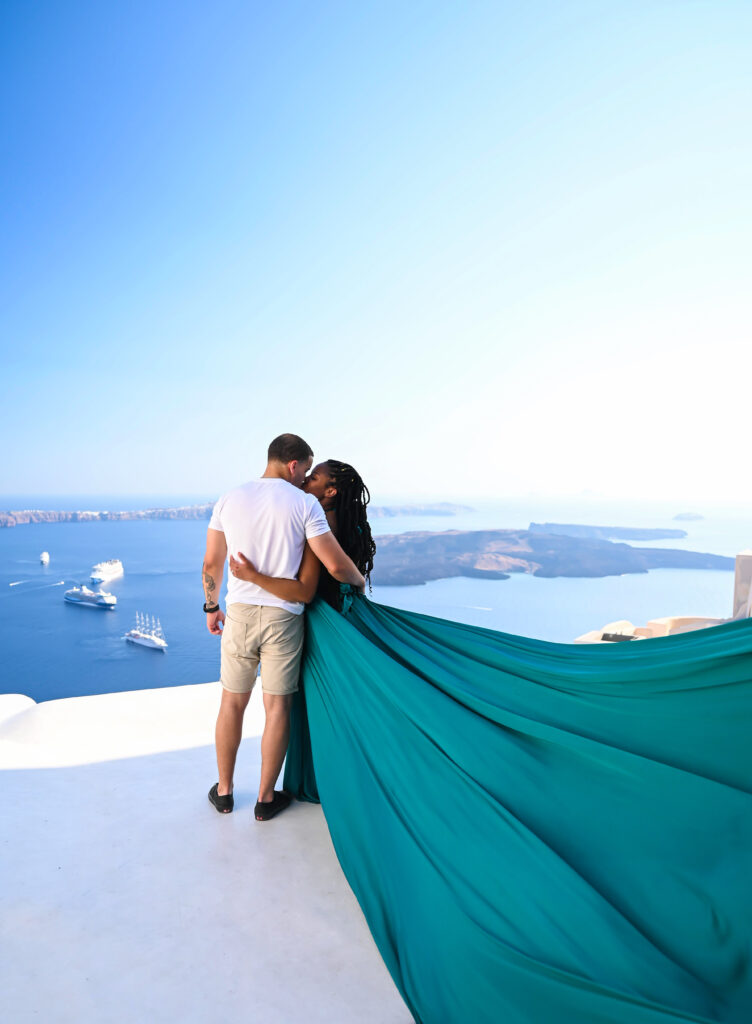 A couple have a kiss in front of amazing volcanic view