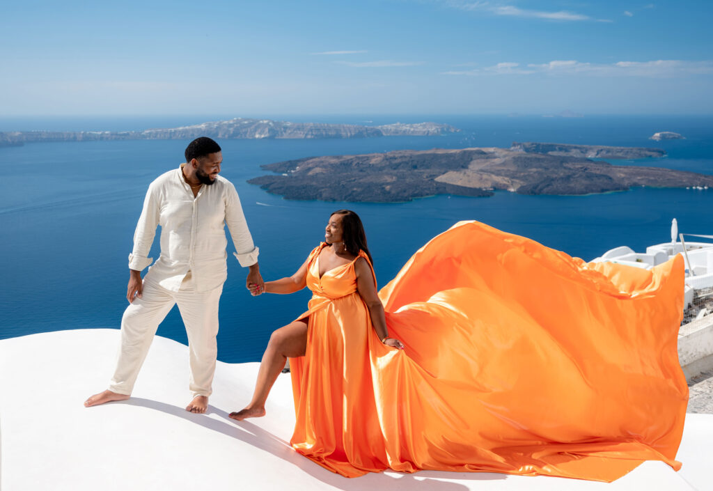 Husband and wife looking each other while enjoy a walk at Santorini