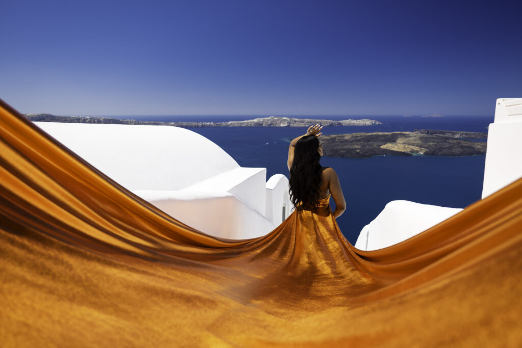 A down view of iconic whitewashed Santorini stairs that leads to the sea at the bottom of caldera