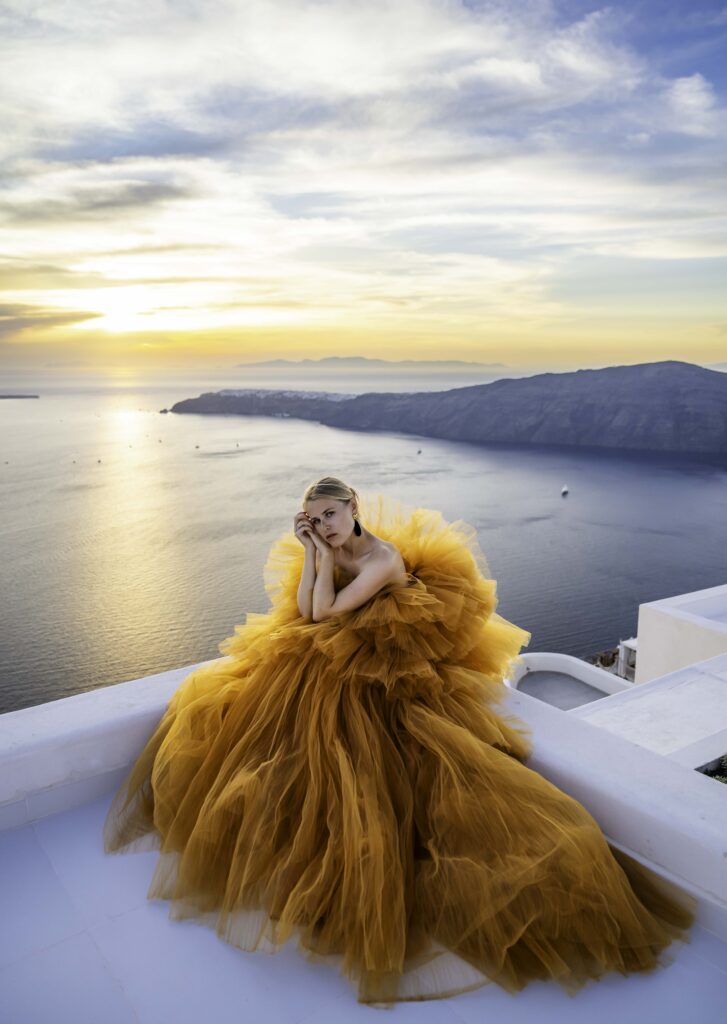 During sunset time, a pose with a blond female having her hands on the cheek