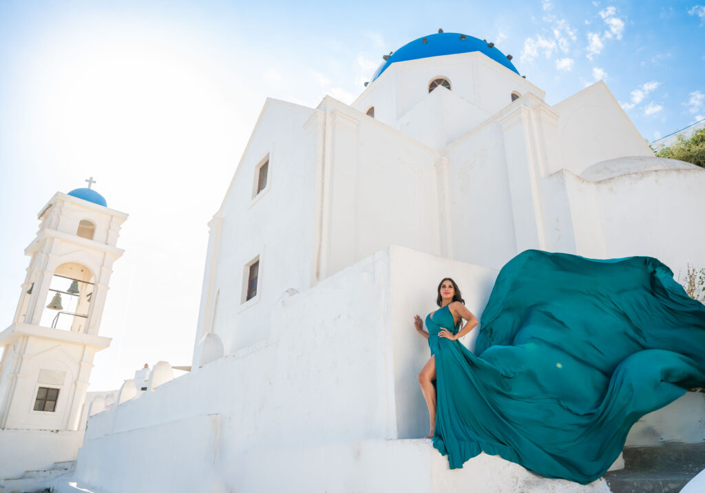 Woman posing on top of blue domes church