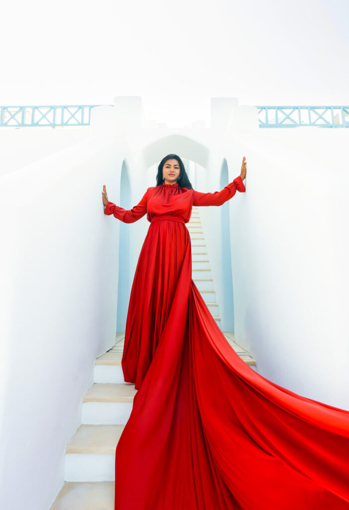 Lady standing on stairs wearing Red Hijab Flying Dress